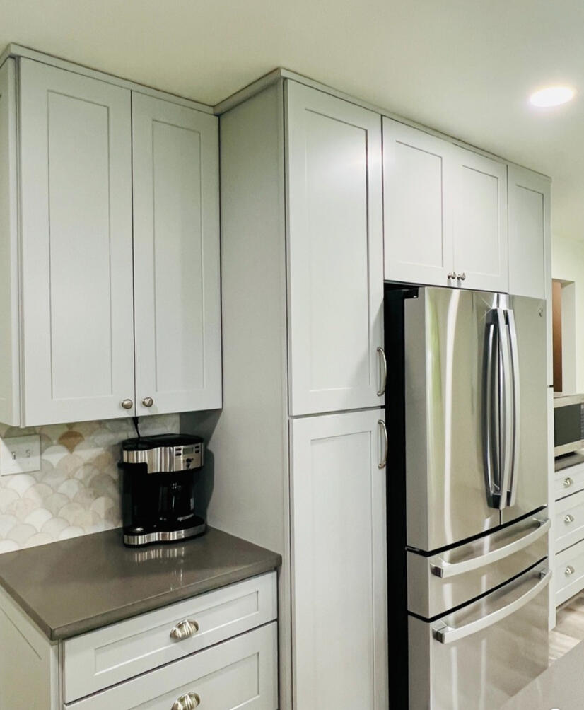 Integrated coffee station designed for convenience while maintaining a clean visual rhythm throughout the cabinetry.