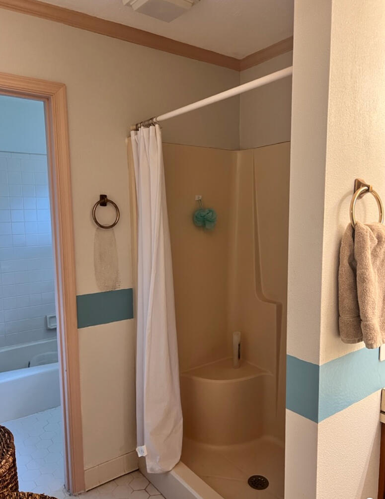 Before construction, the circulation pattern and layout made the room feel disconnected and dated.